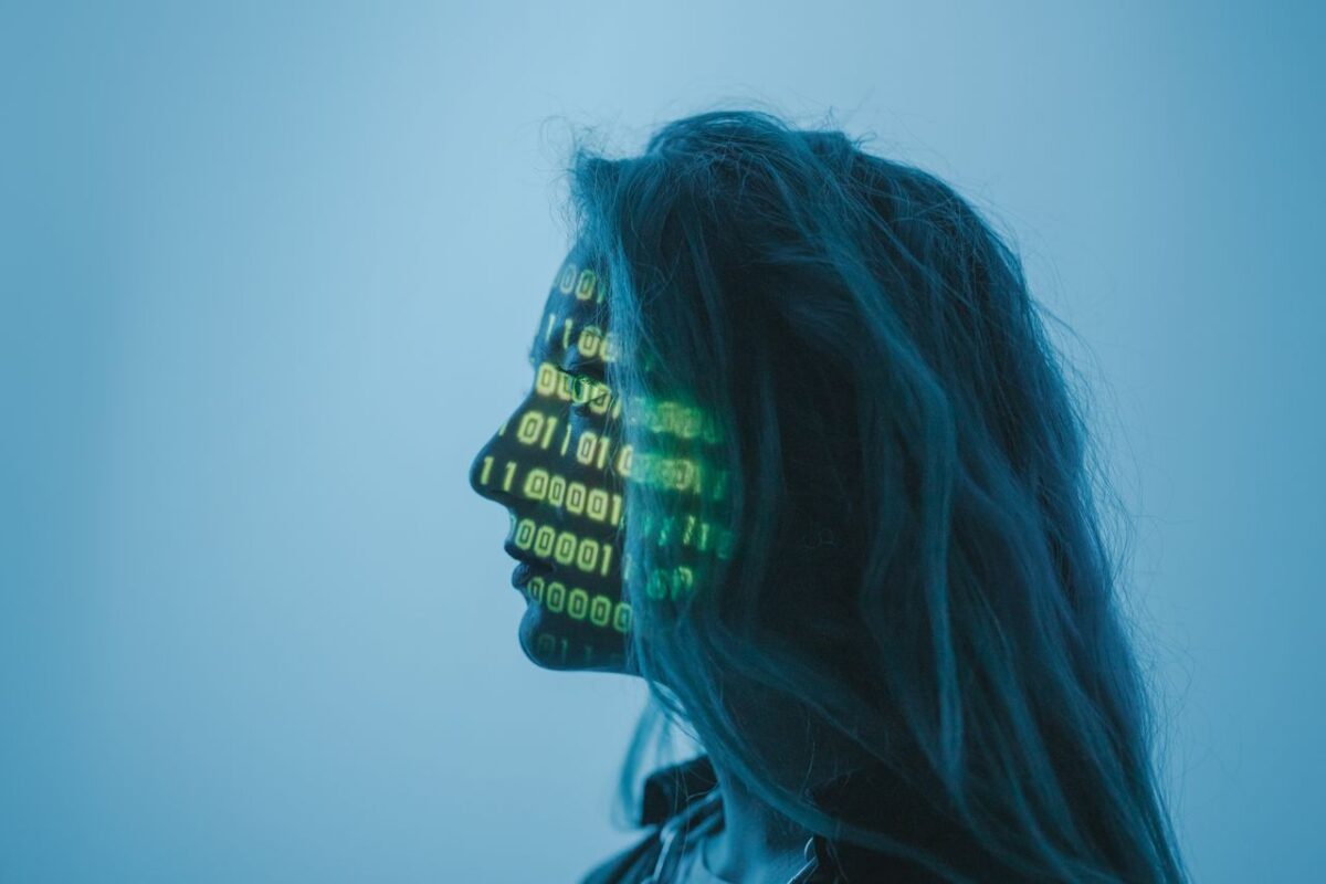 Respublicanova Silhouette of a woman with binary code projected on her face in a digital concept setting.